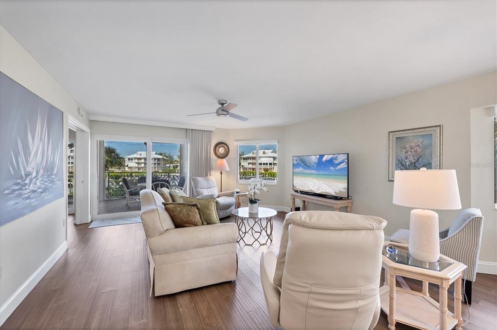 11000 Placida Road, Unit 702 Placida, FL 33946 - Photo 8 of 60 a living room with furniture and a large window