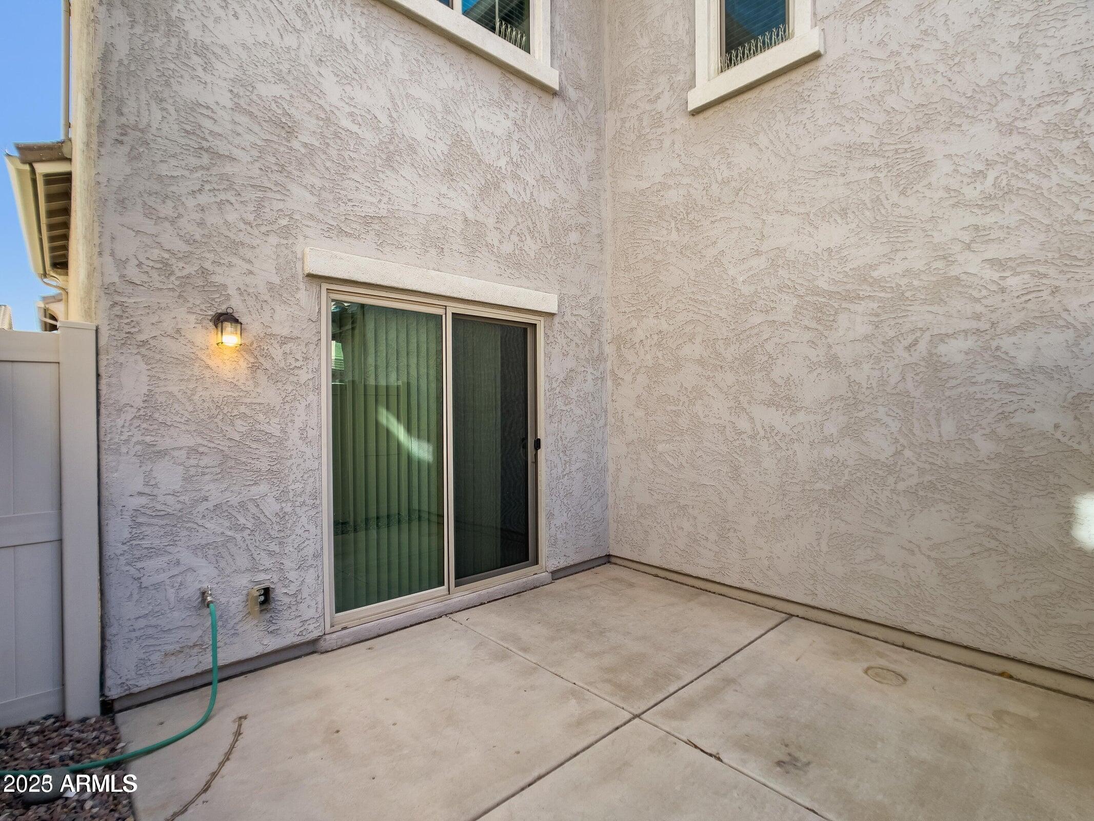 1958 West Busoni Place Phoenix, AZ 85023 - Photo 16 of 42 a view of a brick house with a window