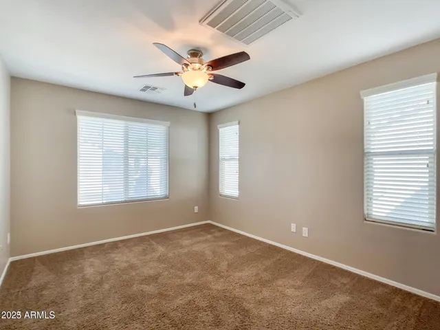 a view of a hallway with a door and stairs