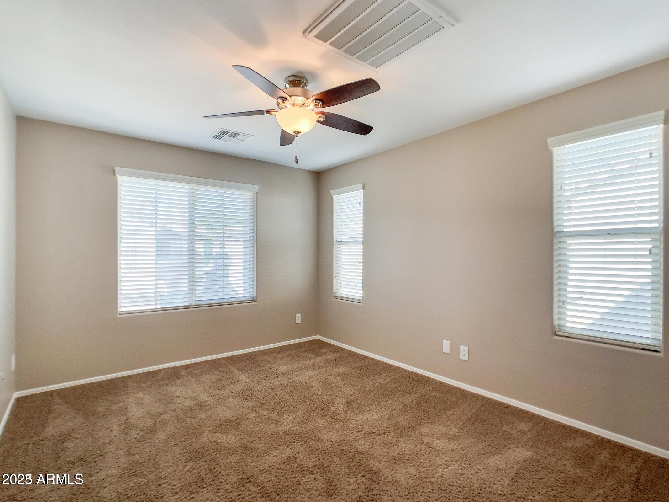 1958 West Busoni Place Phoenix, AZ 85023 - Photo 20 of 42 a view of an empty room with a window