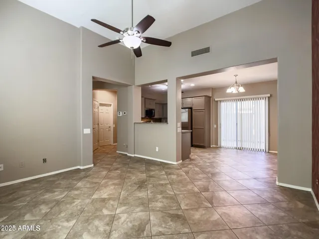 a view of a swimming pool with outdoor seating a patio