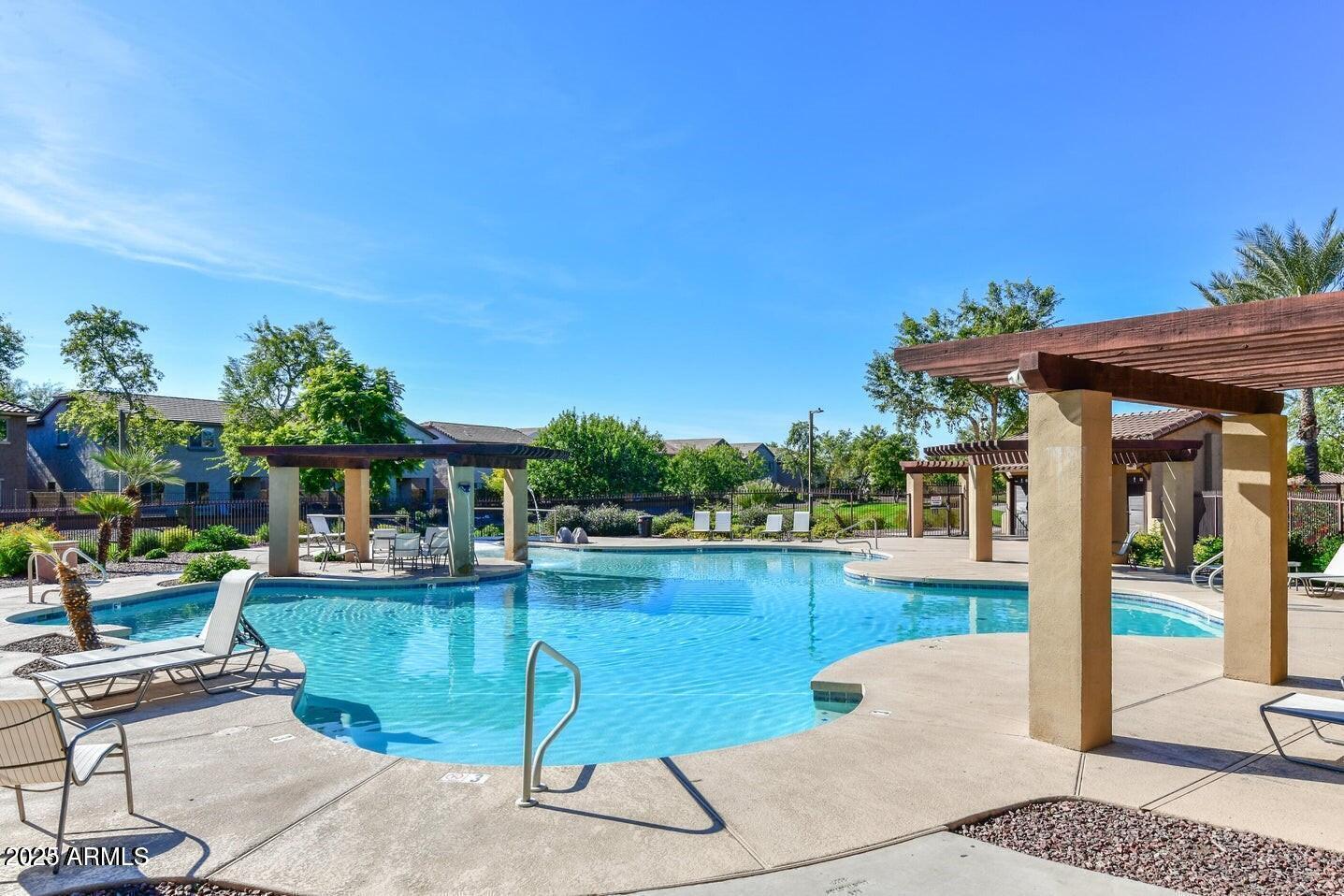 1958 West Busoni Place Phoenix, AZ 85023 - Photo 31 of 42 a view of a patio with swimming pool table and chairs