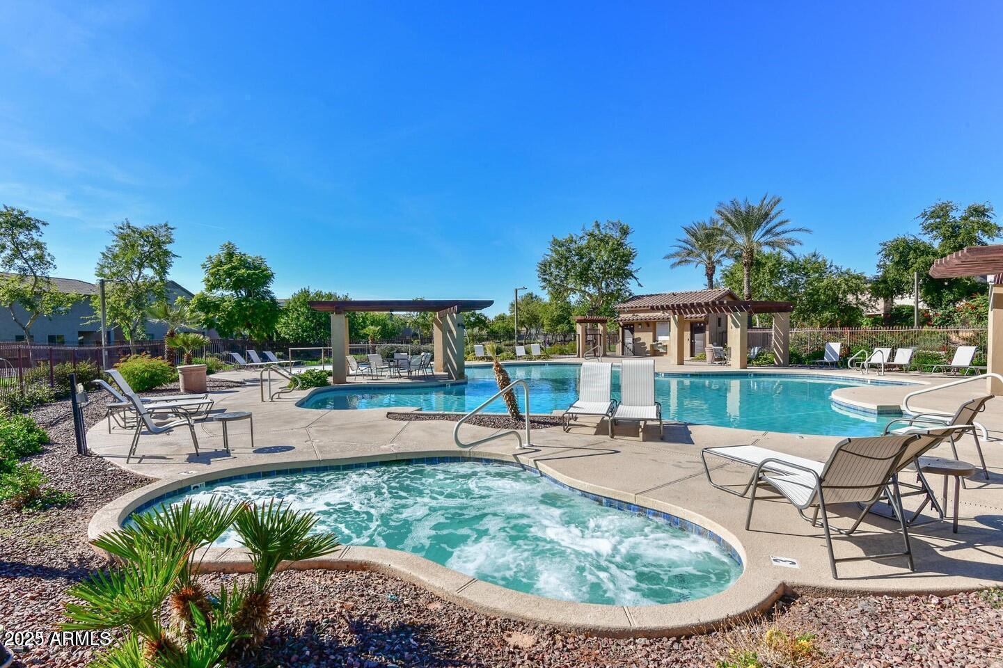 1958 West Busoni Place Phoenix, AZ 85023 - Photo 32 of 42 a view of a swimming pool with outdoor seating a patio