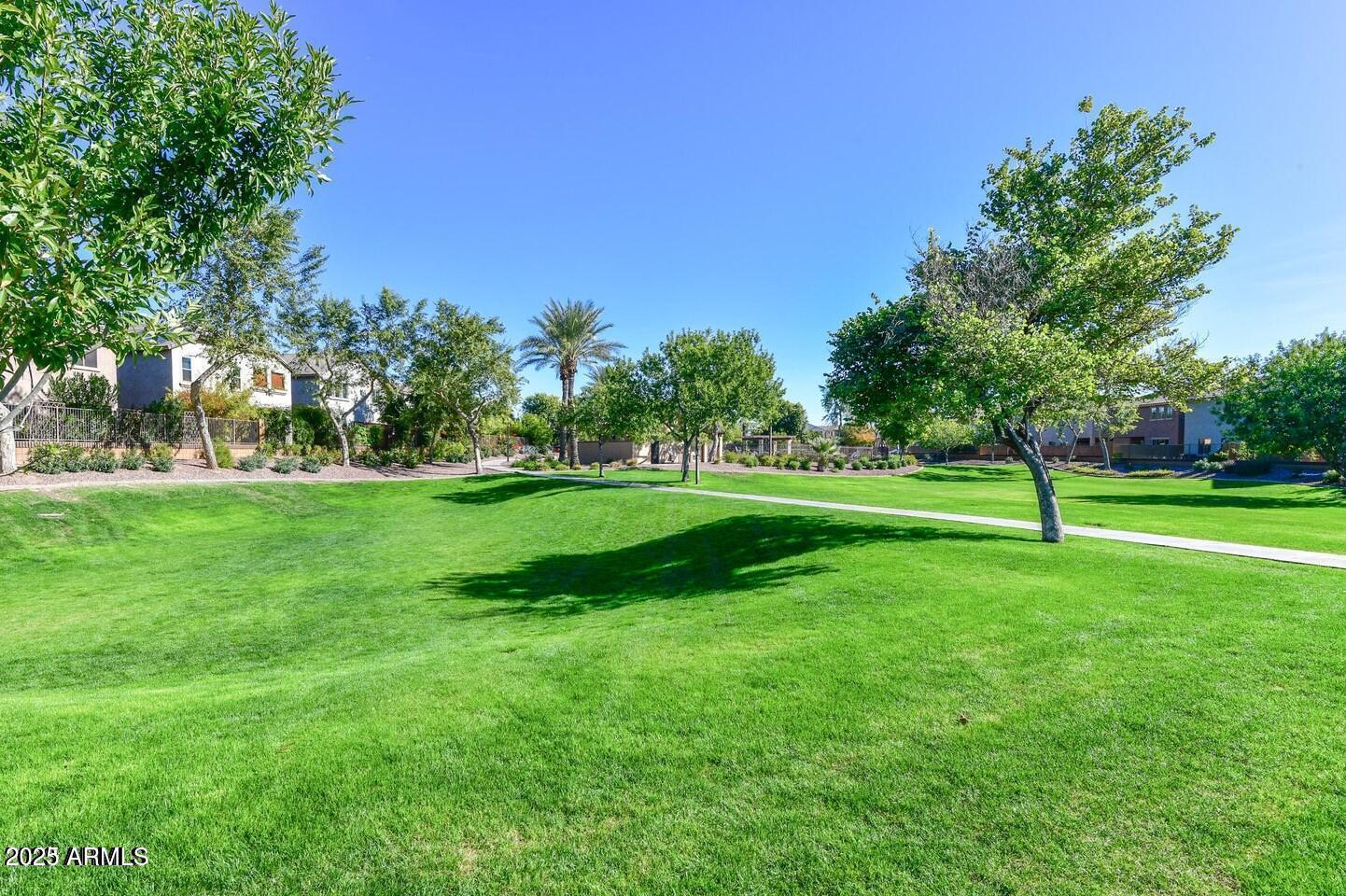 1958 West Busoni Place Phoenix, AZ 85023 - Photo 34 of 42 a view of a park with trees and flowers