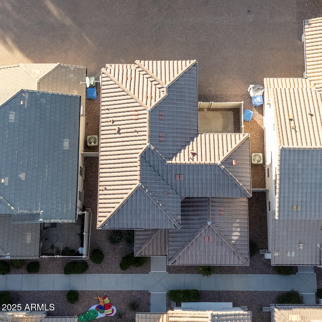 1958 West Busoni Place Phoenix, AZ 85023 - Photo 40 of 42 a front view of a house with a garden