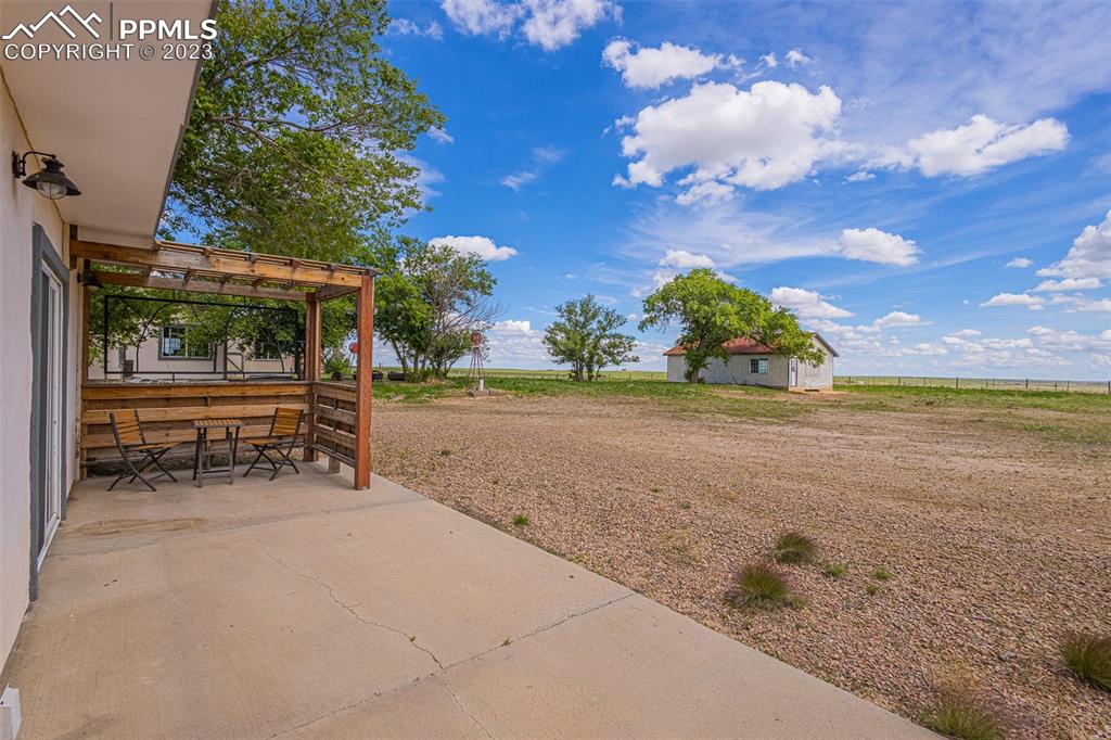 13490 South Lauppe Road Yoder, CO 80864 - Photo 20 of 45 a view of a yard with an outdoor space