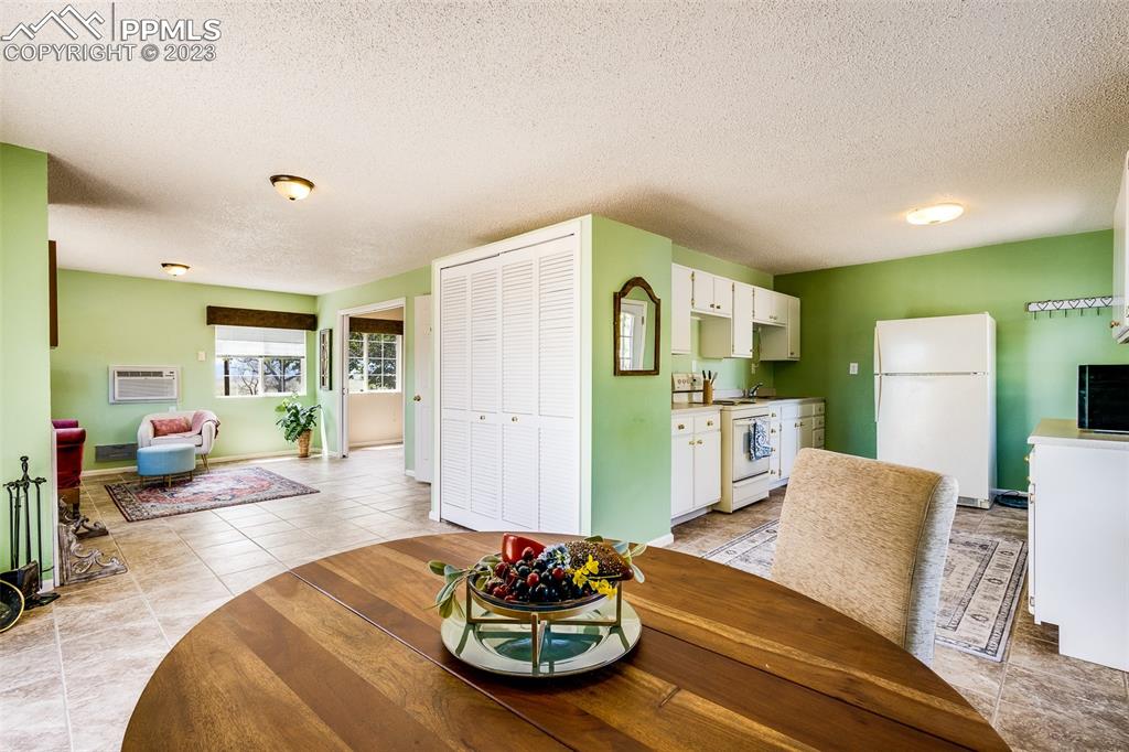 13490 South Lauppe Road Yoder, CO 80864 - Photo 23 of 45 a living room with furniture and a dining table