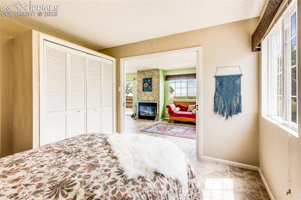 13490 South Lauppe Road Yoder, CO 80864 - Photo 28 of 45 a bedroom with a bed and wooden floor