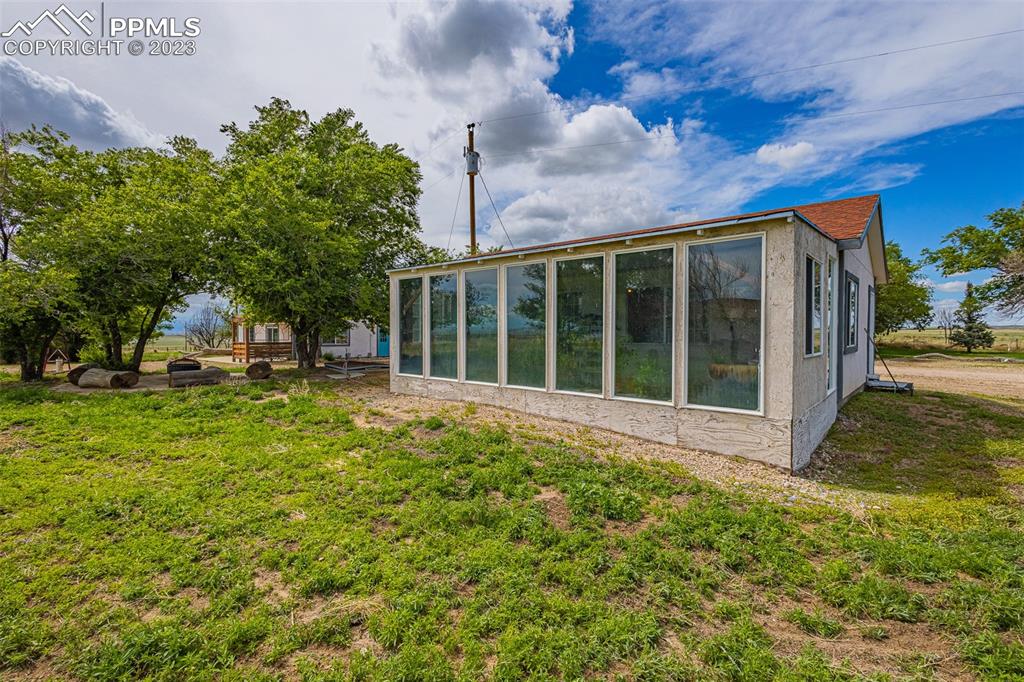 13490 South Lauppe Road Yoder, CO 80864 - Photo 30 of 45 a view of a house with backyard and garden