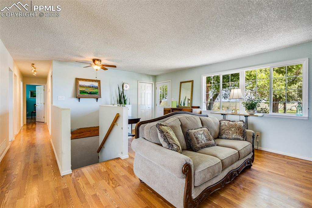 13490 South Lauppe Road Yoder, CO 80864 - Photo 3 of 45 a living room with furniture and a large window