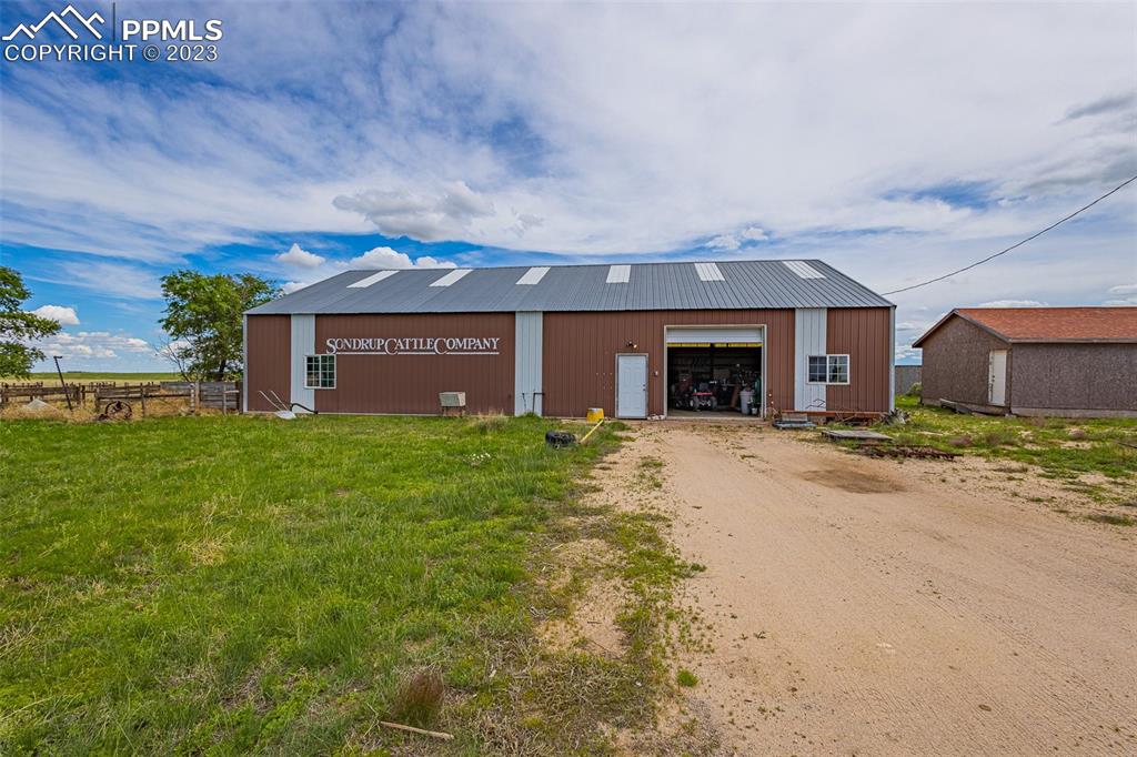 13490 South Lauppe Road Yoder, CO 80864 - Photo 32 of 45 front view of a house with a yard