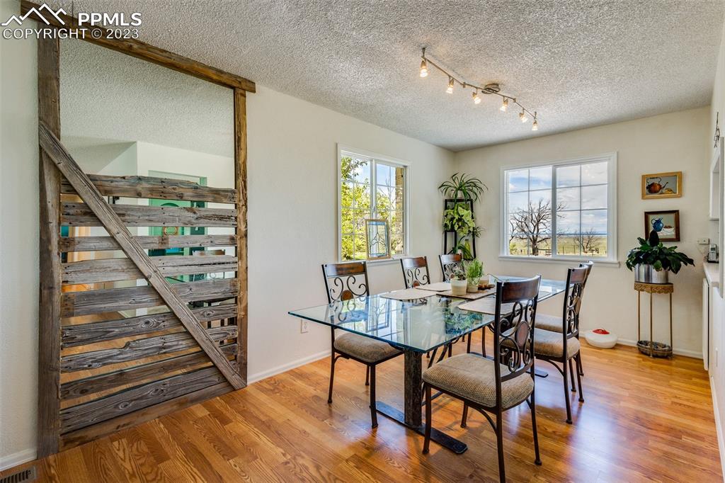 13490 South Lauppe Road Yoder, CO 80864 - Photo 4 of 45 a view of a dining room with furniture window and wooden floor