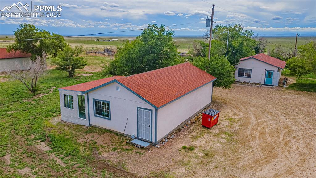 13490 South Lauppe Road Yoder, CO 80864 - Photo 42 of 45 a aerial view of a house with a yard