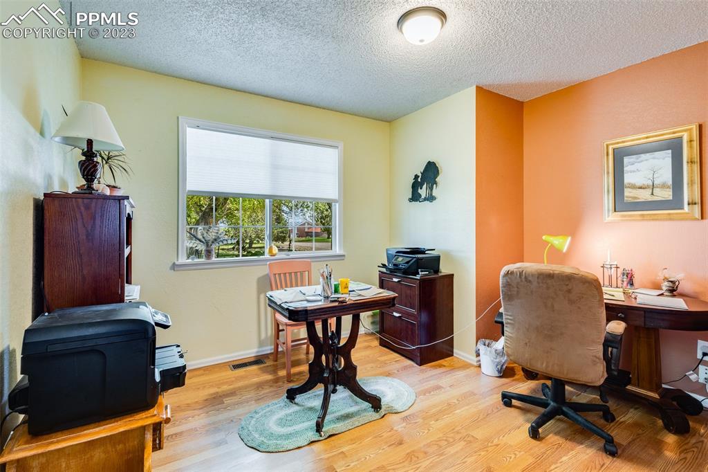 13490 South Lauppe Road Yoder, CO 80864 - Photo 10 of 45 a livingroom with workspace and a window
