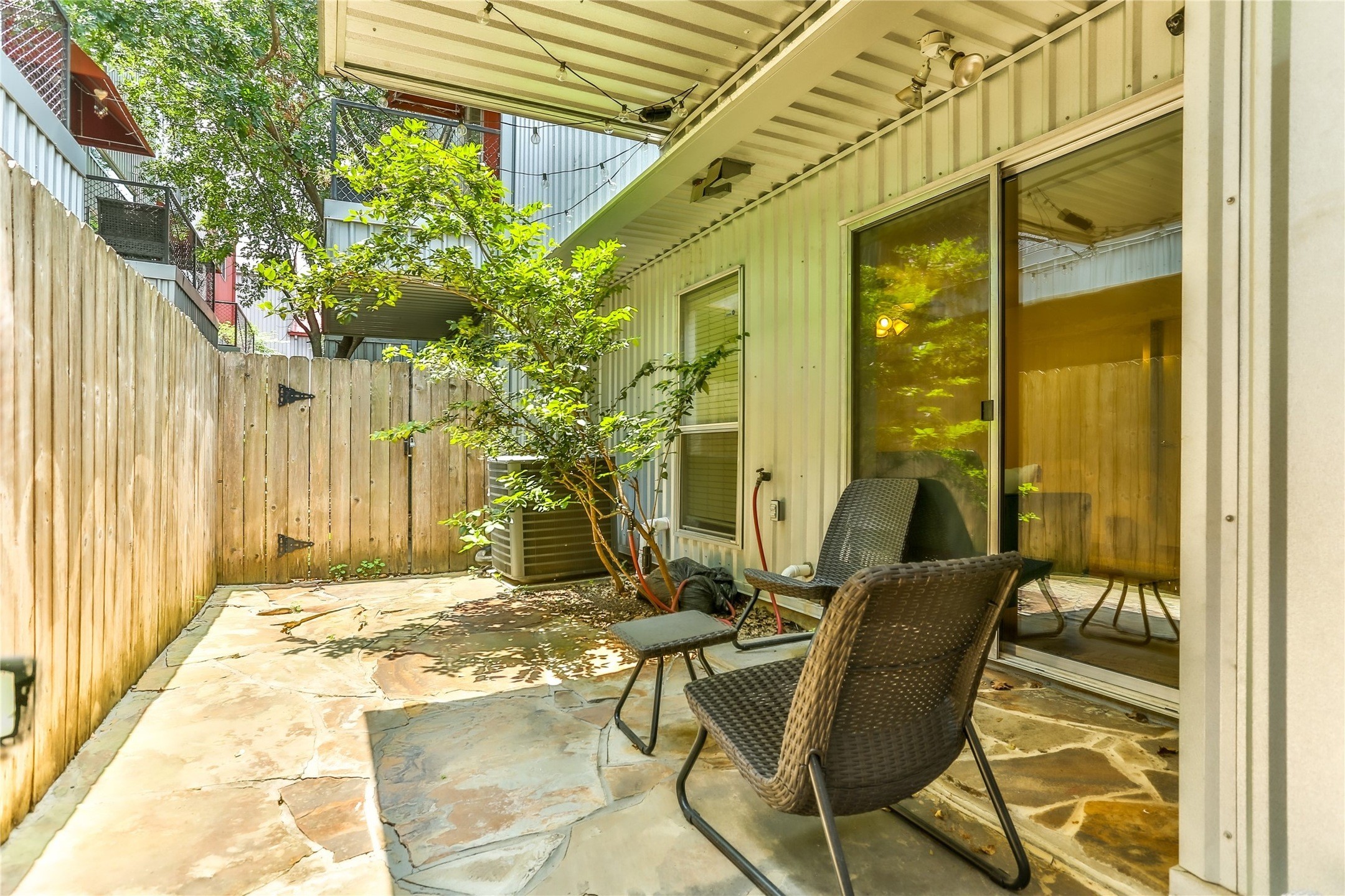 2918 Commerce Street Houston, TX 77003 - Photo 8 of 18 a view of a patio with table and chairs and wooden fence