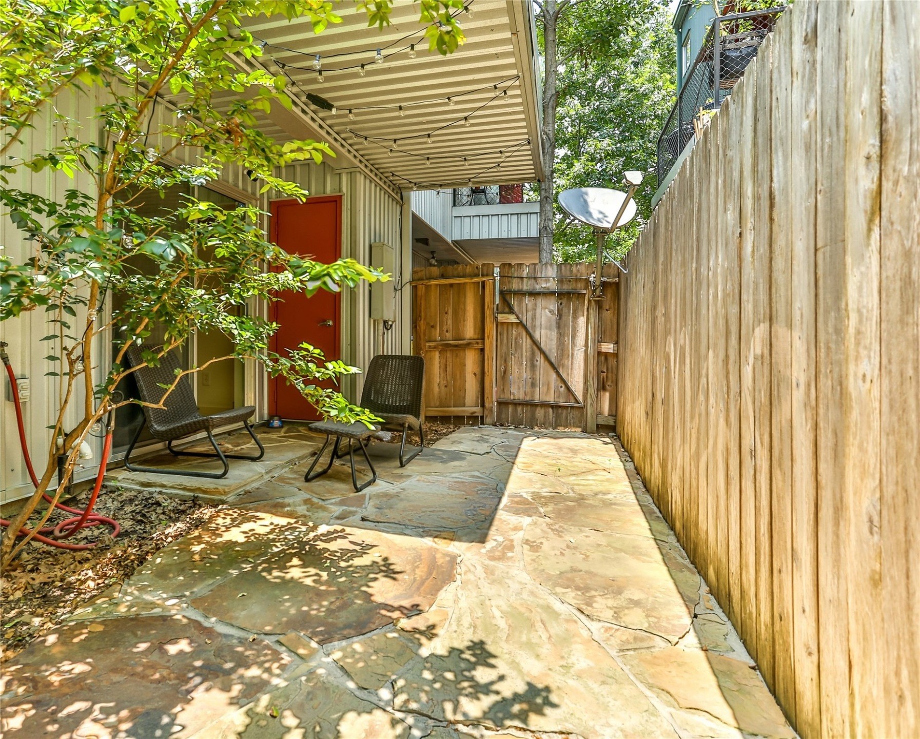 2918 Commerce Street Houston, TX 77003 - Photo 9 of 18 a view of a patio with table and chairs and potted plants