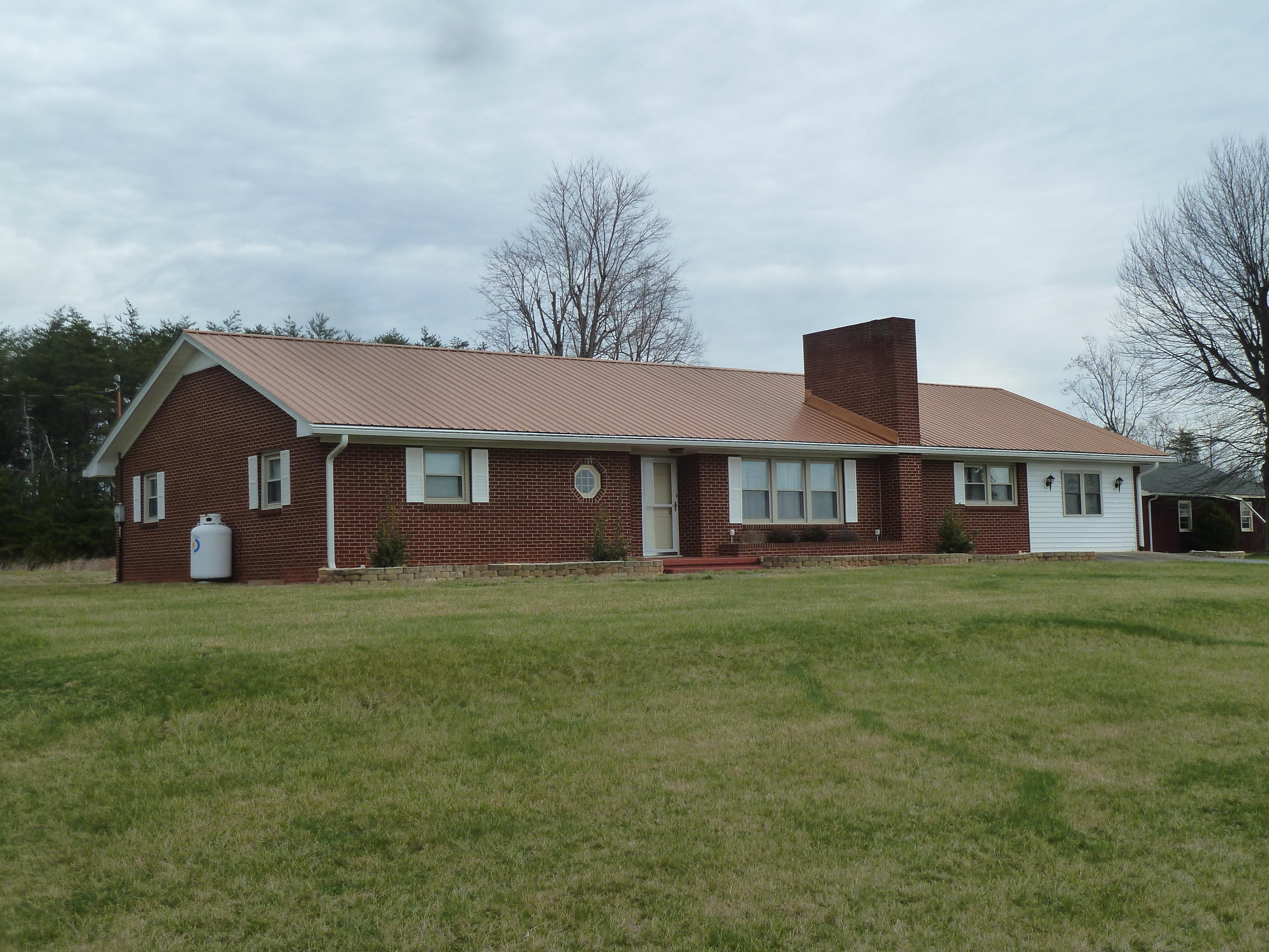 13692 West Gretna Road Sandy Level, VA 24161 - Photo 1 of 58 a front view of a house with a garden