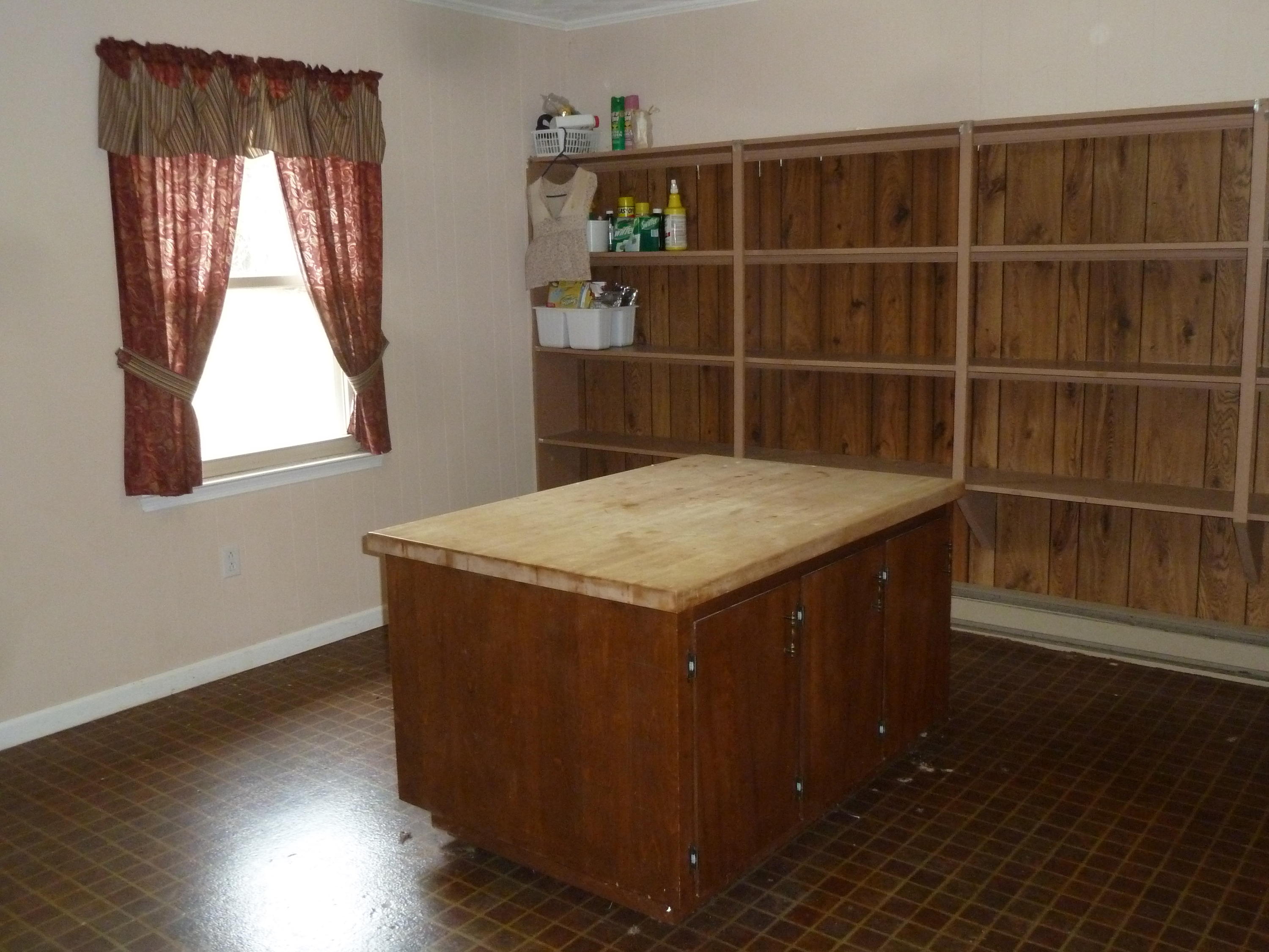 13692 West Gretna Road Sandy Level, VA 24161 - Photo 13 of 58 a kitchen with wooden floors and window