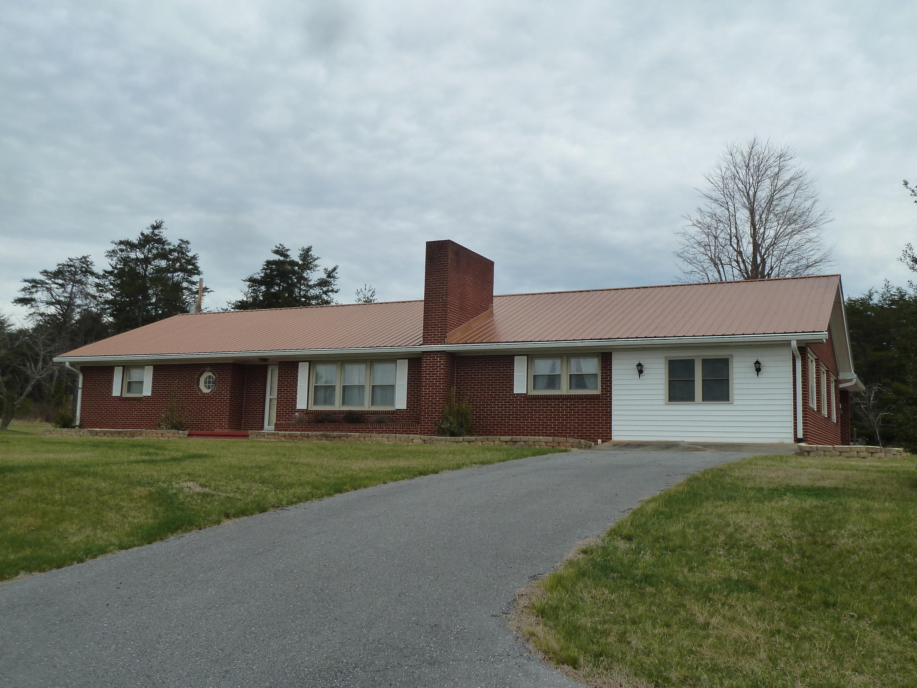 13692 West Gretna Road Sandy Level, VA 24161 - Photo 3 of 58 a front view of a house with a yard and garage