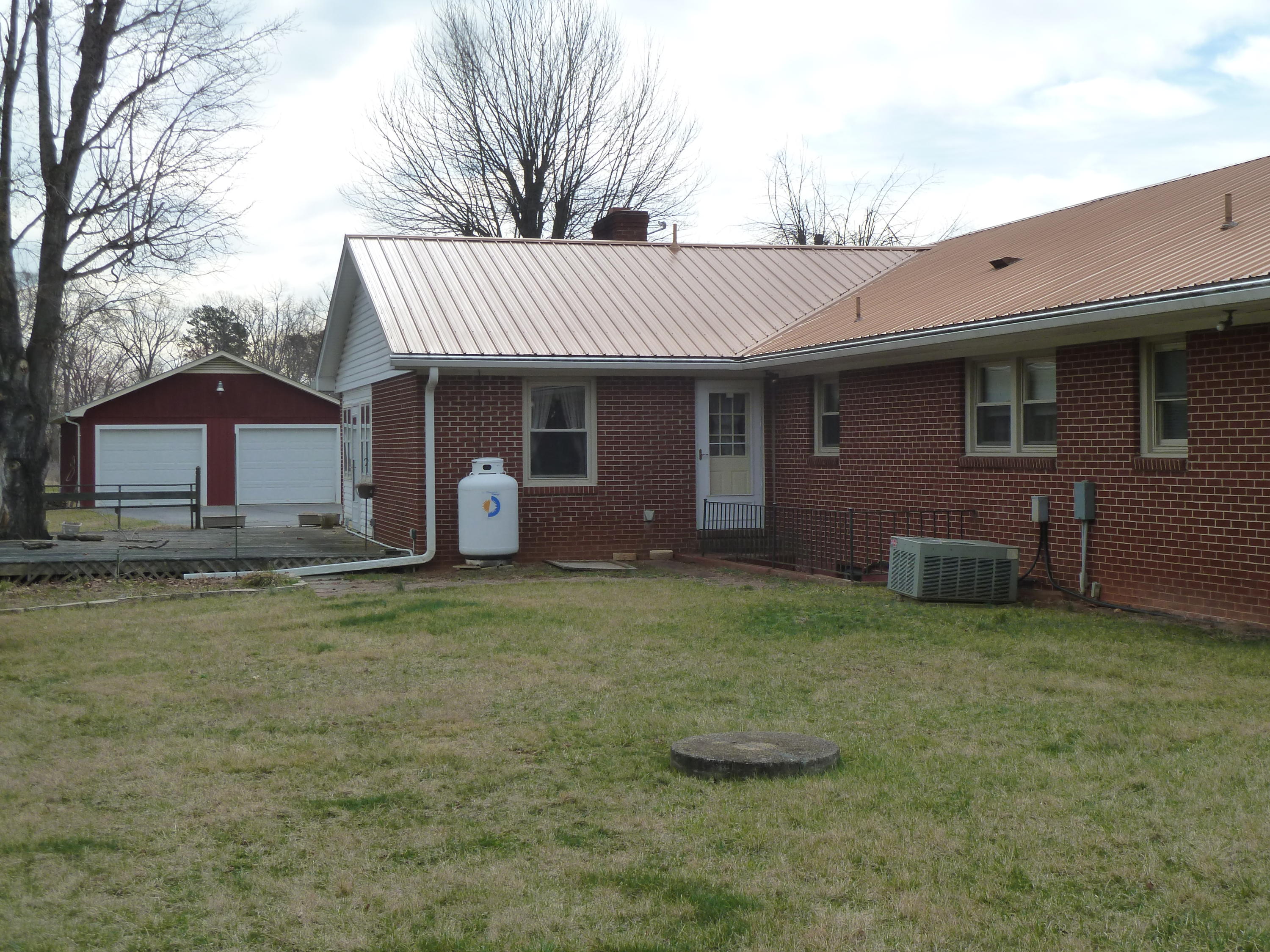 13692 West Gretna Road Sandy Level, VA 24161 - Photo 22 of 58 a backyard of a house with table and chairs