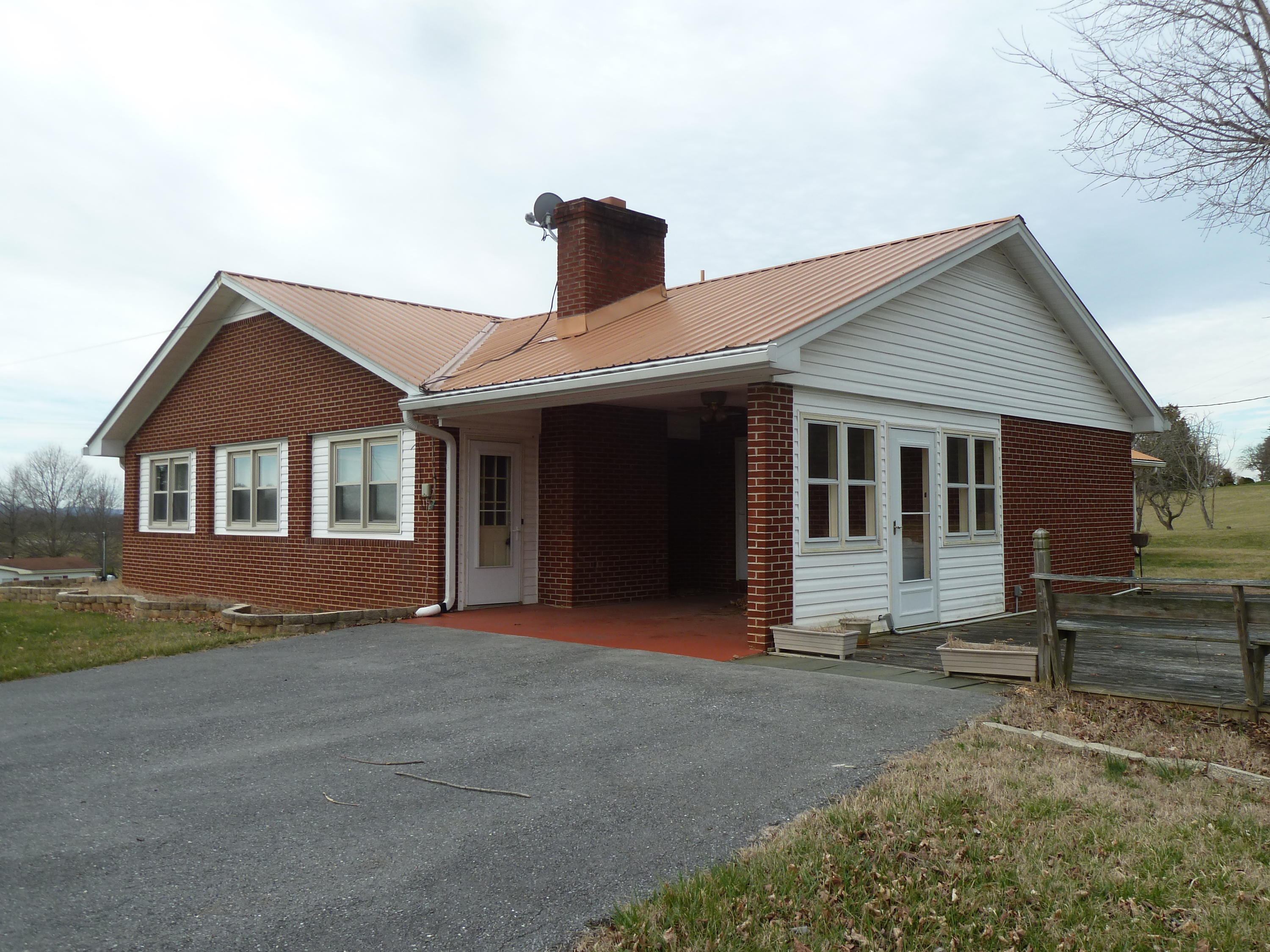 13692 West Gretna Road Sandy Level, VA 24161 - Photo 4 of 58 a front view of a house with a garden