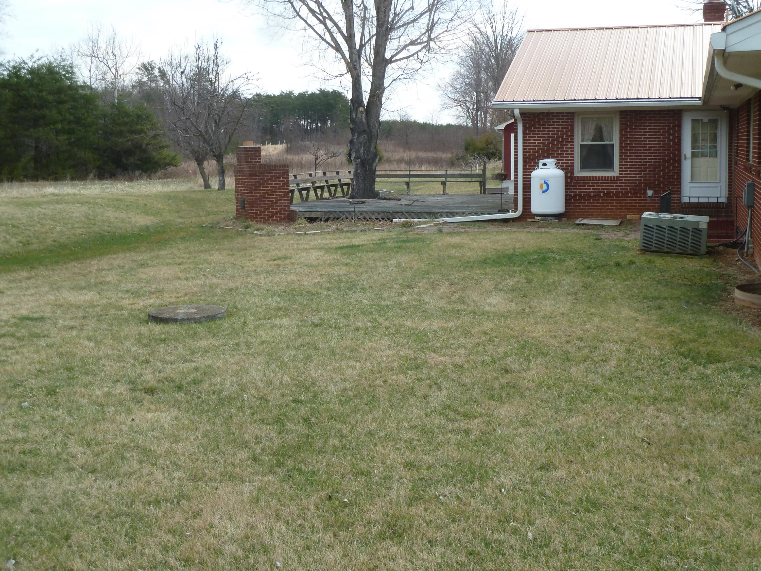 13692 West Gretna Road Sandy Level, VA 24161 - Photo 31 of 58 a view of a house with a yard and large tree