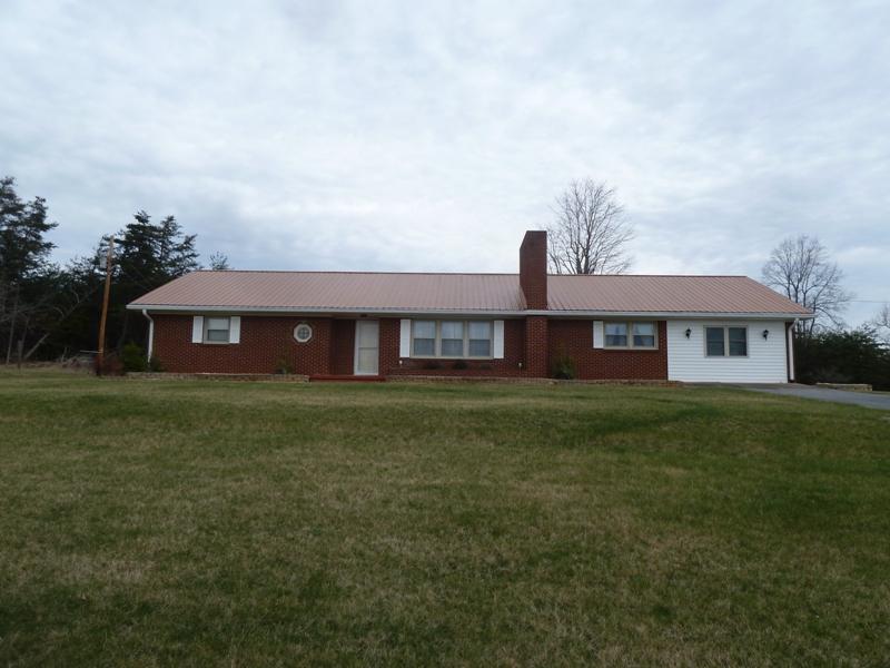 13692 West Gretna Road Sandy Level, VA 24161 - Photo 32 of 58 a front view of a house with a garden