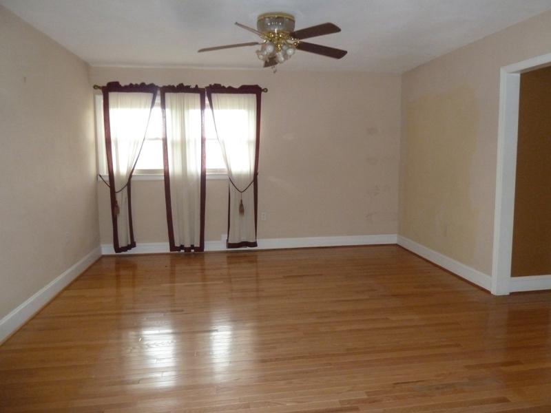 13692 West Gretna Road Sandy Level, VA 24161 - Photo 43 of 58 an empty room with wooden floor and windows
