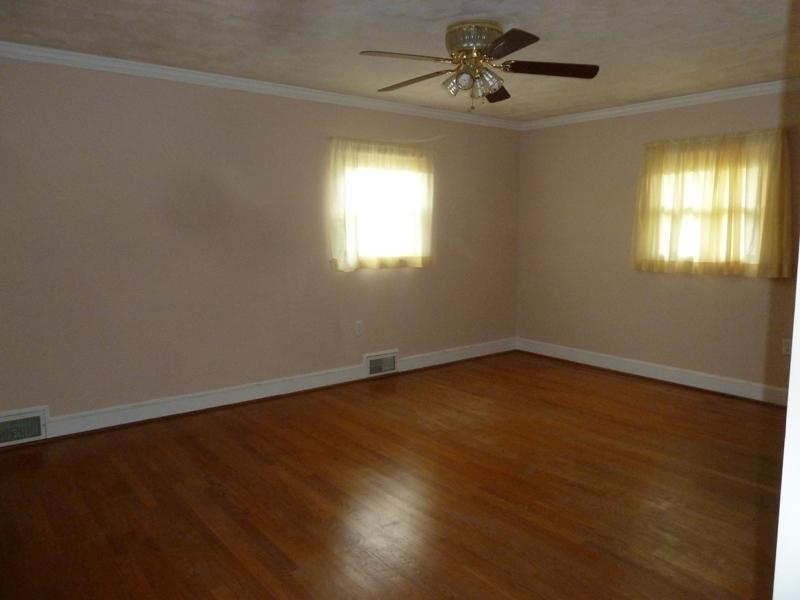 13692 West Gretna Road Sandy Level, VA 24161 - Photo 47 of 58 an empty room with a window and a ceiling fan