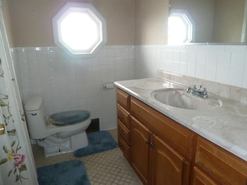 13692 West Gretna Road Sandy Level, VA 24161 - Photo 54 of 58 a bathroom with a granite countertop toilet sink and mirror
