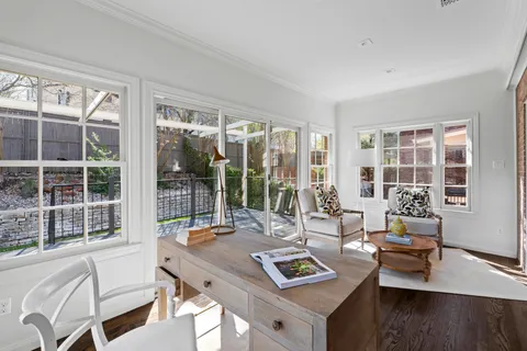 a living room with fireplace furniture and a flat screen tv