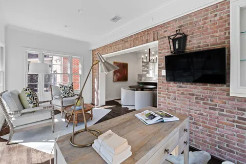 a kitchen with stainless steel appliances granite countertop a sink and a refrigerator