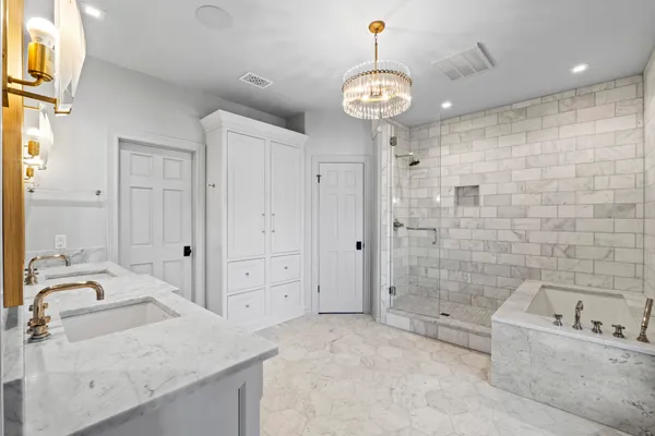 a spacious bathroom with a granite countertop sink a mirror and a