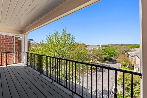 a view of pathway with a balcony