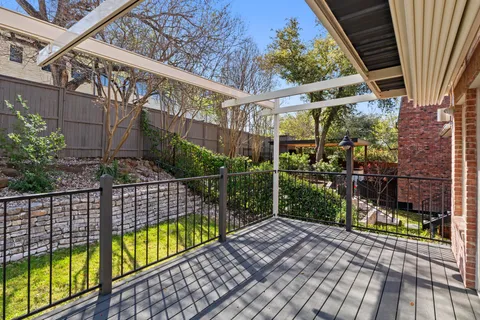 a view of a house with backyard porch and sitting area