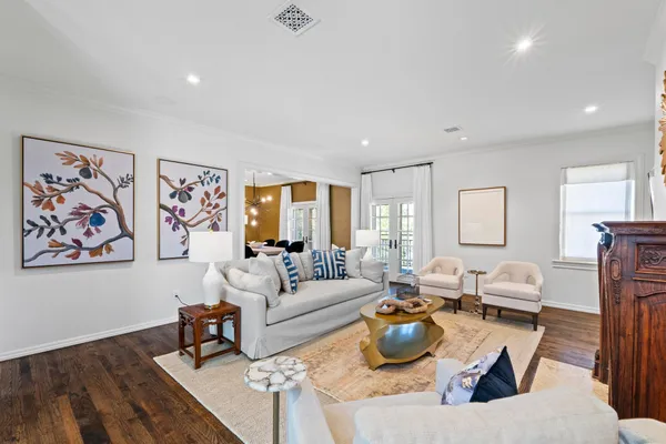 a living room with fireplace furniture and a flat screen tv