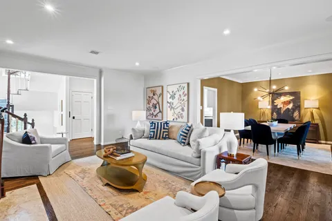 a kitchen with a sink cabinets and wooden floor