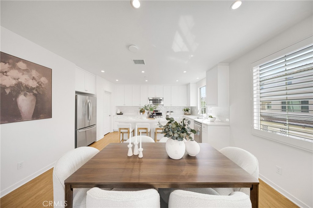 716 Spring Garden Irvine, CA 92618 - Photo 14 of 44 a view of a dining room with furniture