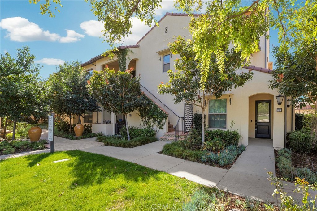 716 Spring Garden Irvine, CA 92618 - Photo 2 of 44 a front view of a house with garden