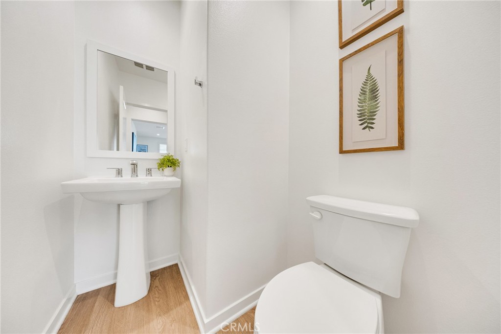 716 Spring Garden Irvine, CA 92618 - Photo 23 of 44 a bathroom with a toilet sink and mirror