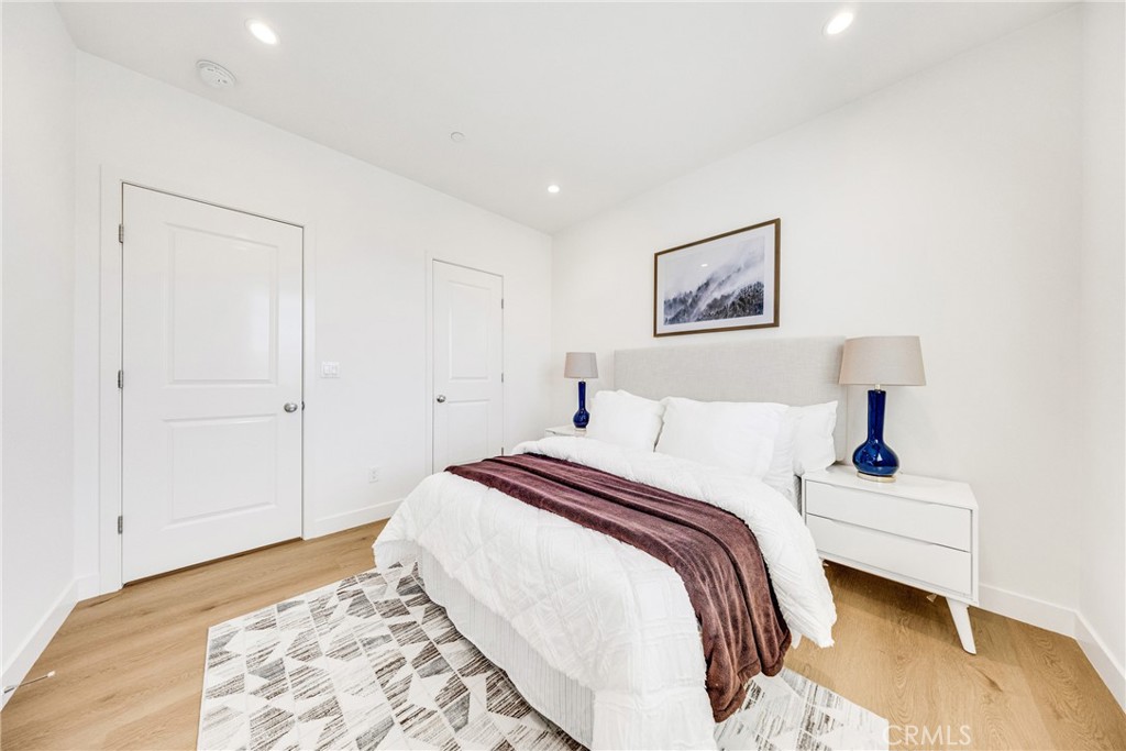716 Spring Garden Irvine, CA 92618 - Photo 35 of 44 a bedroom with a bed and a painting on the wall