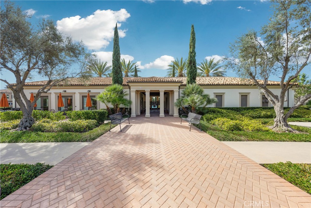 716 Spring Garden Irvine, CA 92618 - Photo 44 of 44 a front view of a house with yard and green space