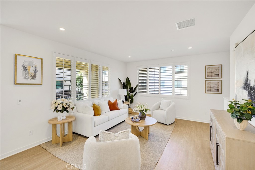 716 Spring Garden Irvine, CA 92618 - Photo 8 of 44 a living room with furniture and window