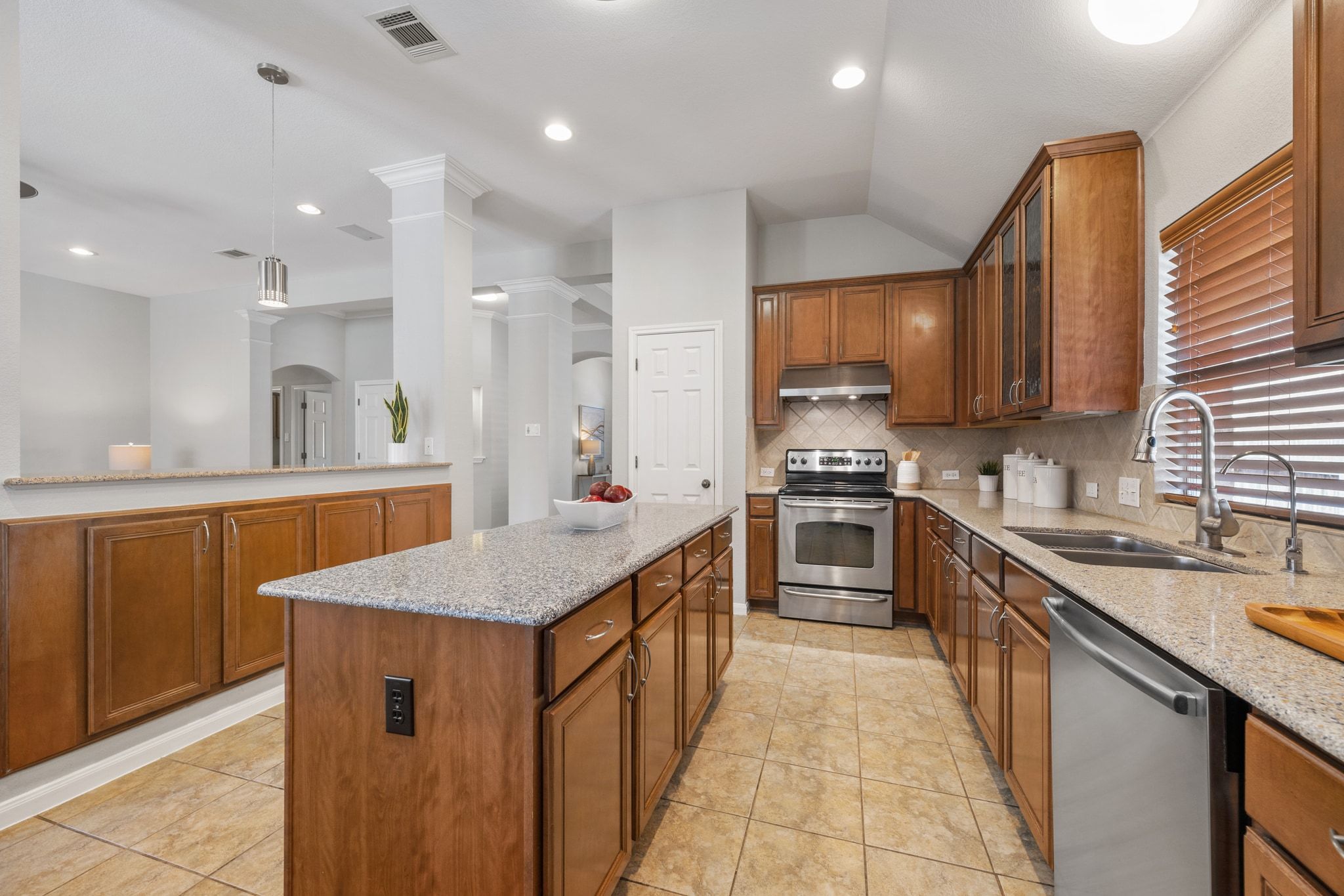 9905 Savannah Ridge Drive Austin, TX 78726 - Photo 14 of 35 Deep counters and plenty of cabinet storage keep everything organized and within reach for your next meal