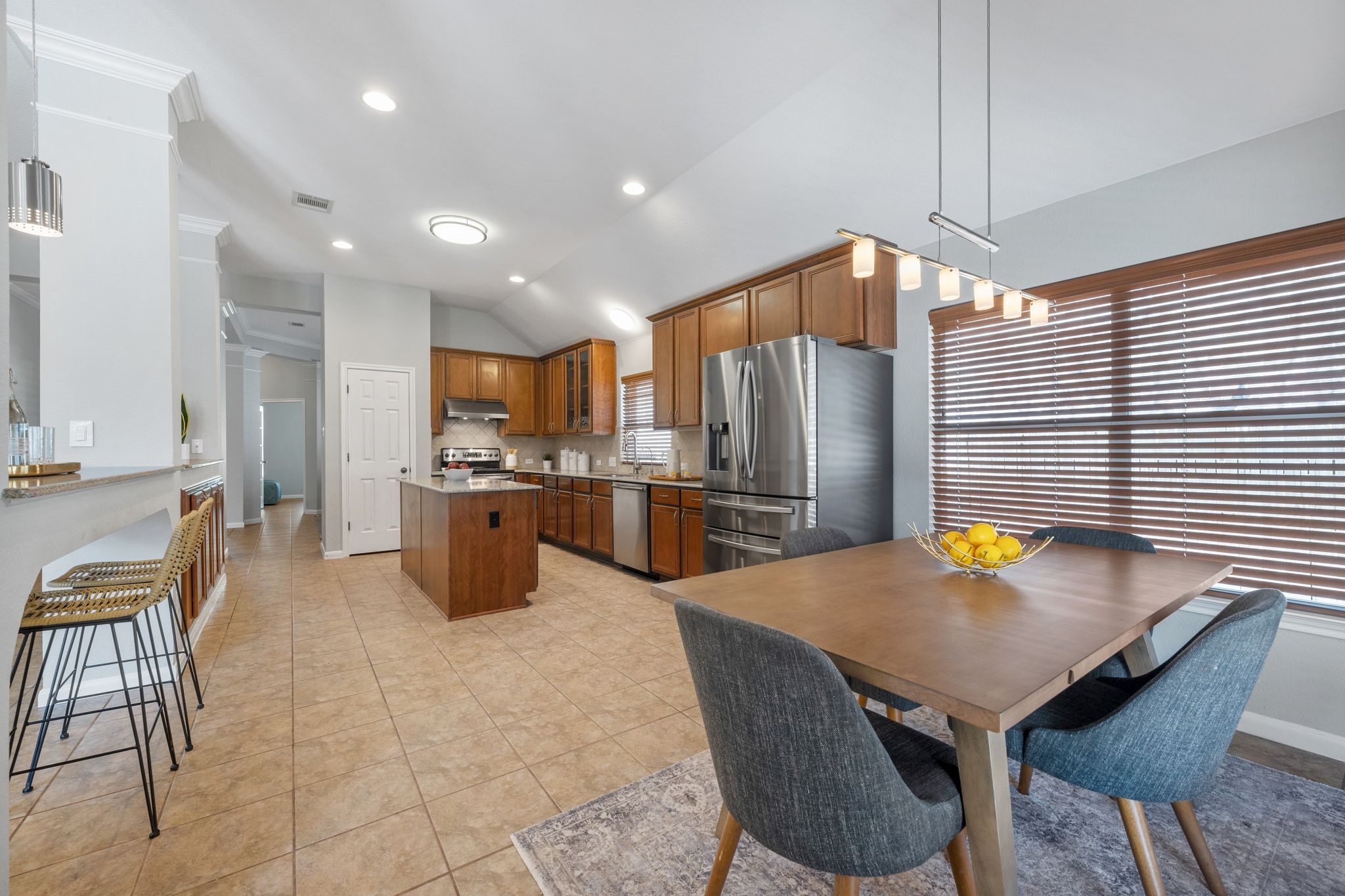 9905 Savannah Ridge Drive Austin, TX 78726 - Photo 16 of 35 Large enough for a full table, this dining space transitions easily from a morning breakfast spot to a temporary workspace