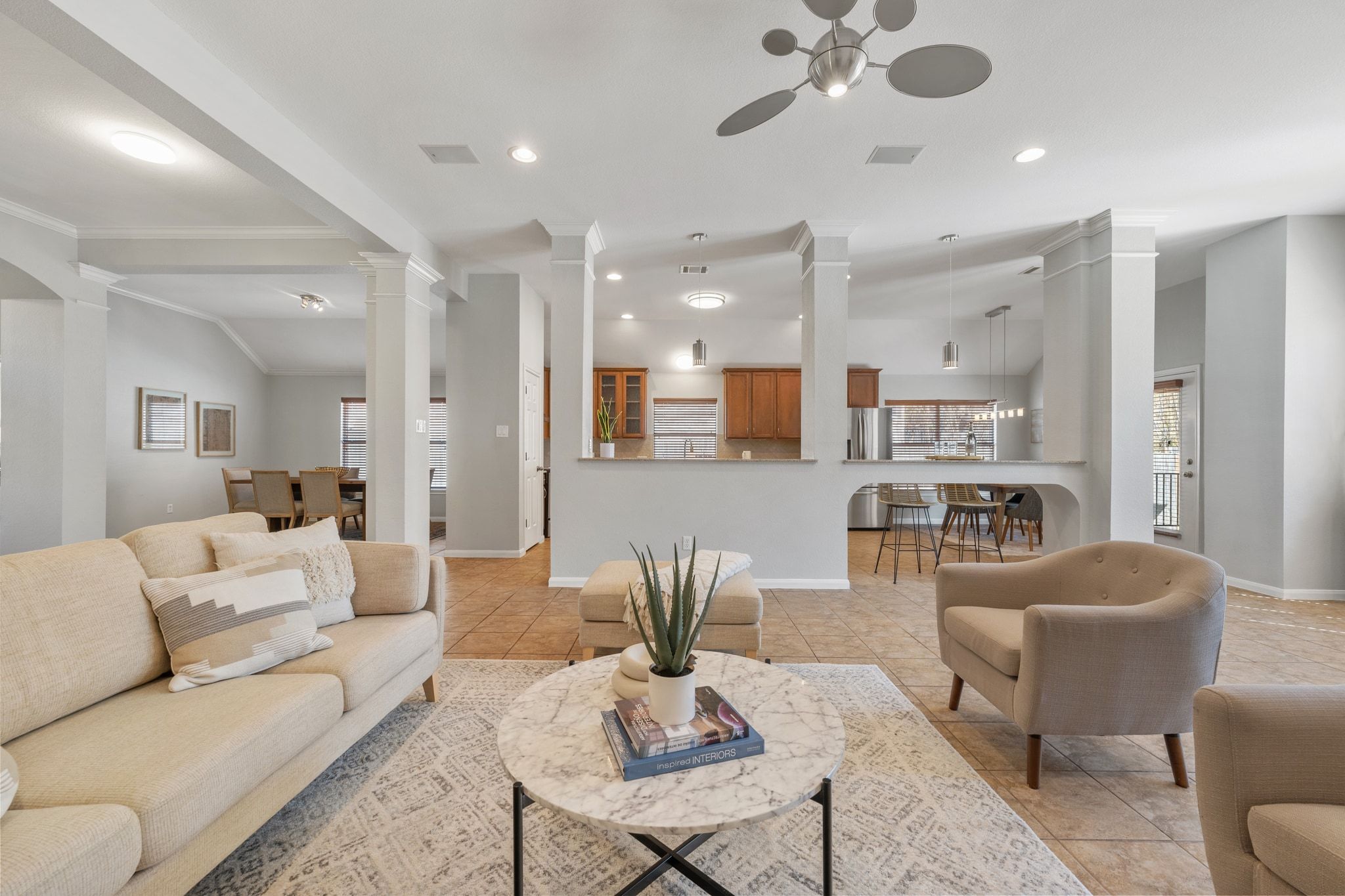 9905 Savannah Ridge Drive Austin, TX 78726 - Photo 8 of 35 This central gathering space connects the kitchen and the back patio, making it easy to host friends