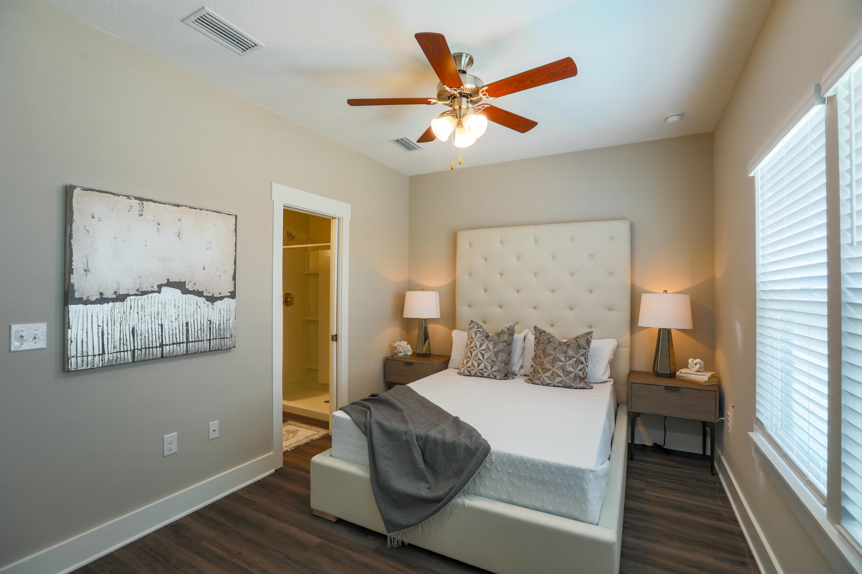246 North Sand Palm Road, Unit 134VISTA Freeport, FL 32439 - Photo 24 of 29 a bedroom with a large bed and a chandelier