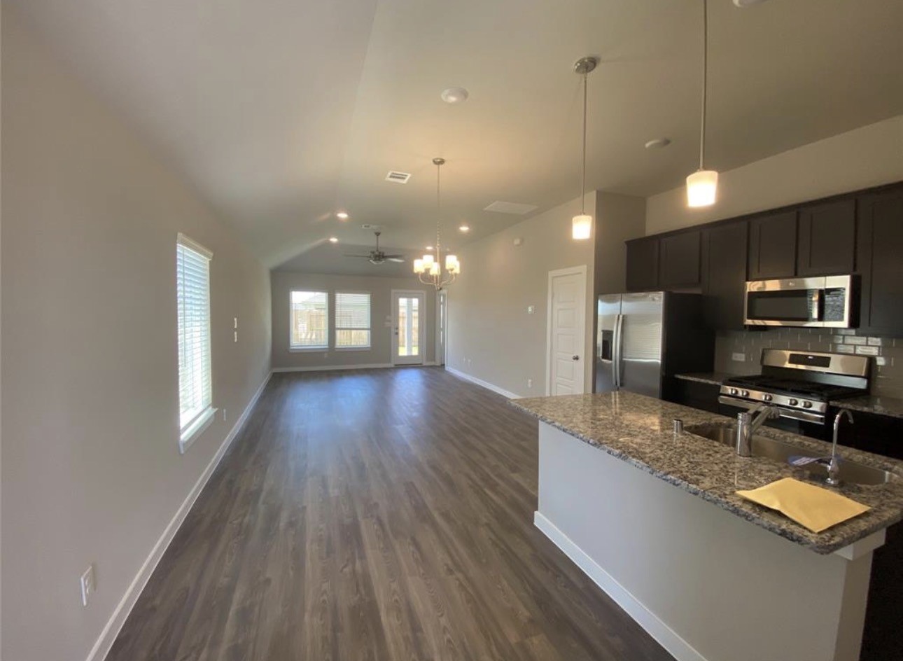3119 Spanish Oak Lane Rosenberg, TX 77471 - Photo 7 of 18 a view of a kitchen with a sink and microwave