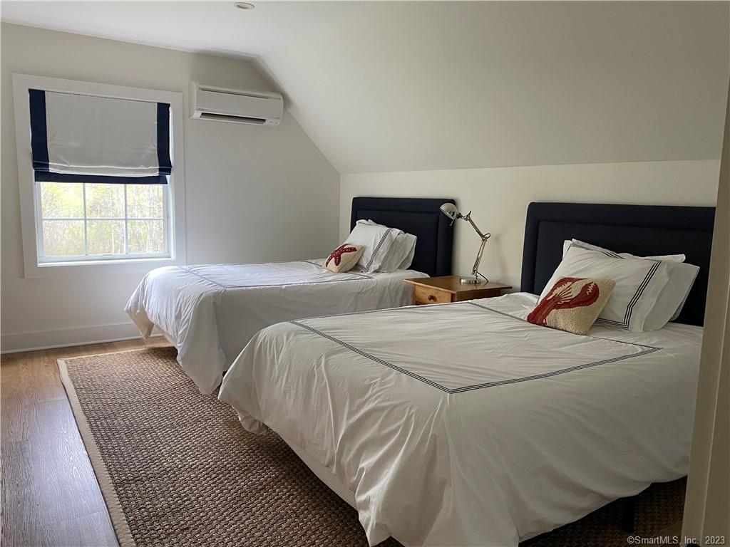 55 Still Meadow Road Sharon, CT 06069 - Photo 20 of 24 a bedroom with a bed and window