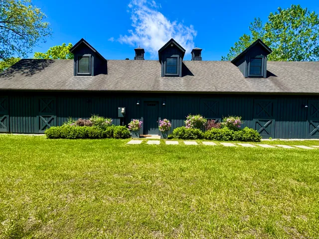 a view of house with yard